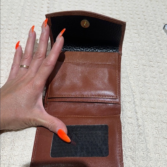 Dooney & Bourke Vintage
AWL Kiss Lock Wallet
Black and Brown Leather Wallet - Picture 2 of 7